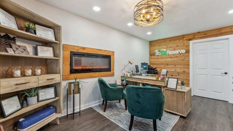 a living room filled with furniture and a tv
